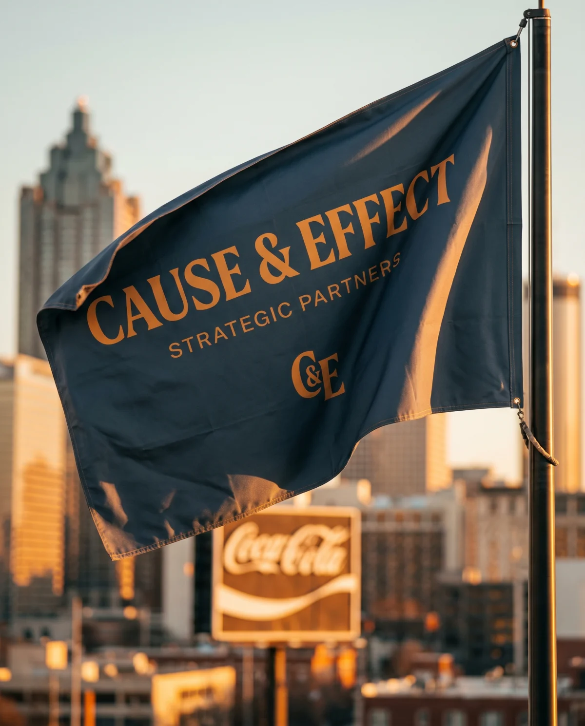 Cause & Effect Strategic Partners flag flying over the Atlanta skyline — built for Atlanta small businesses